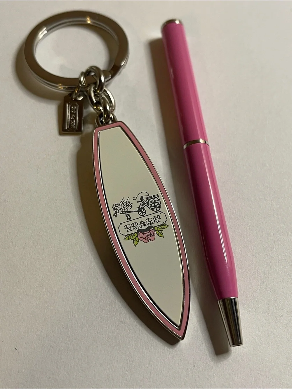 Coach Surfboard Keychain in Pink and Cream and Pink Coach Pen